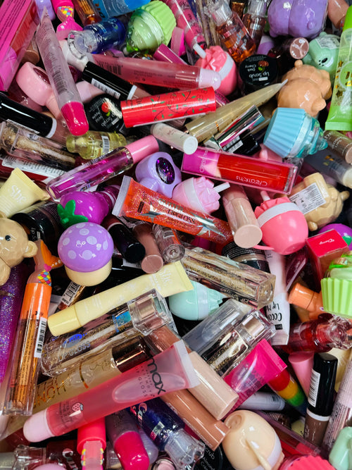 A bin overflowing with lip glosses, ready to be scooped