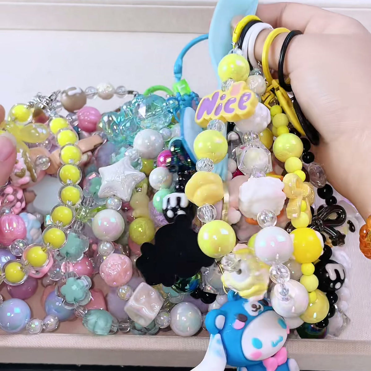 Charms and keychains laid out after a scoop