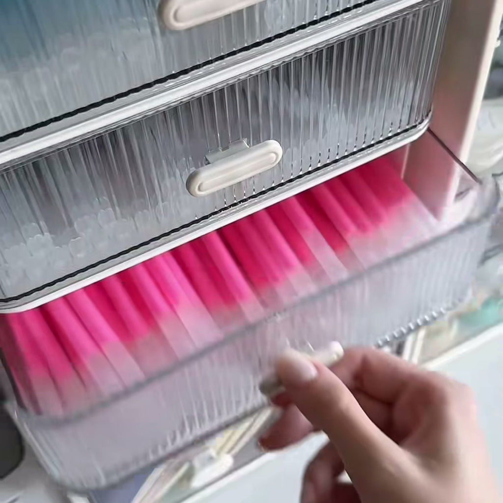Pink highlighters and pens in the drawer